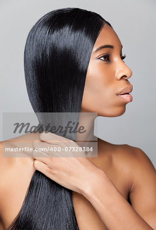 Beautiful young black woman with long straight hair