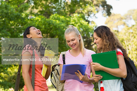 Group of happy female college friends at the campus