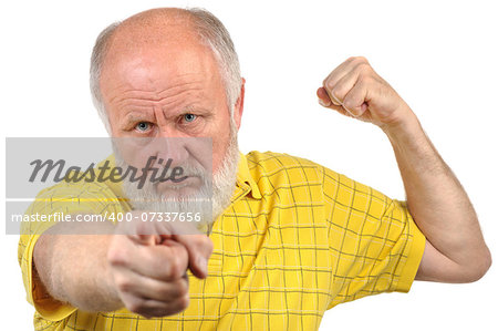 menacing senior bald man in yellow shirt