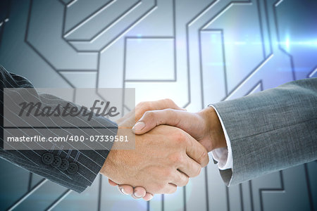 Composite image of business handshake against circuit board on futuristic background