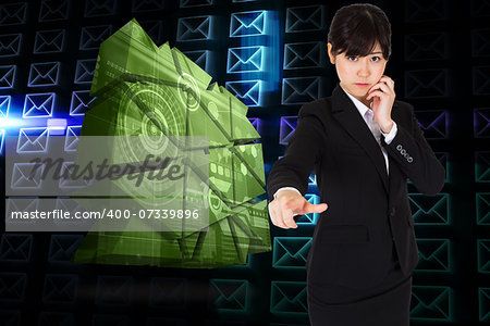 Thoughtful businesswoman pointing against glowing envelopes on black background