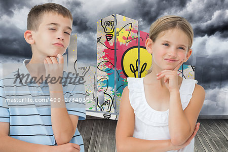 Thoughtful brother and sister posing together against sky painted on wall