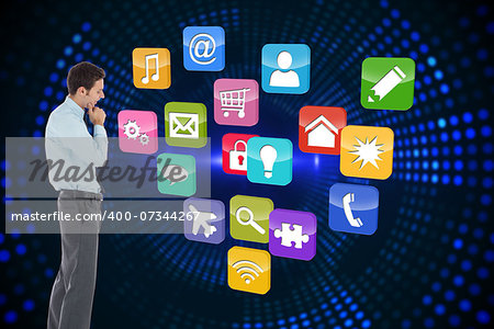Thoughtful businessman with hand on chin against futuristic dotted blue and black background