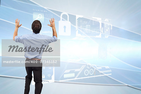 Businessman posing with arms up against linear grey background
