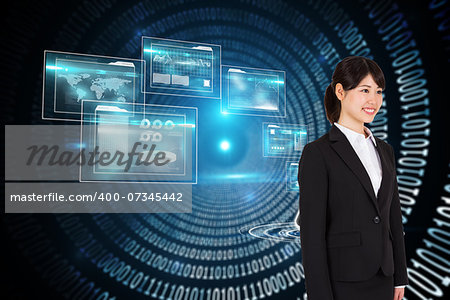 Smiling businesswoman against spiral of shiny binary code