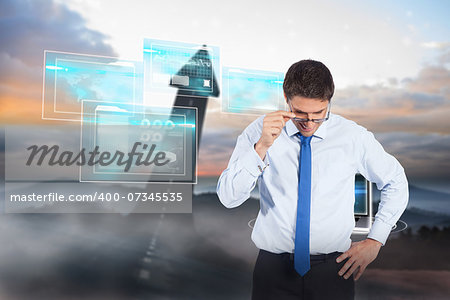 Thinking businessman tilting glasses against road turning into arrow