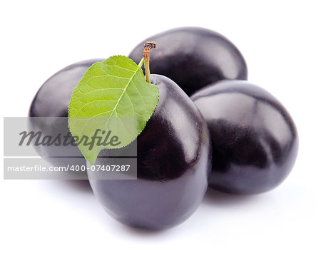 Sweet plums fruit on white closeup