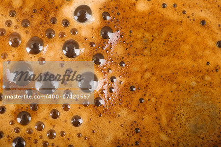 texture of freshly brewed coffee and milk with foam and bubbles