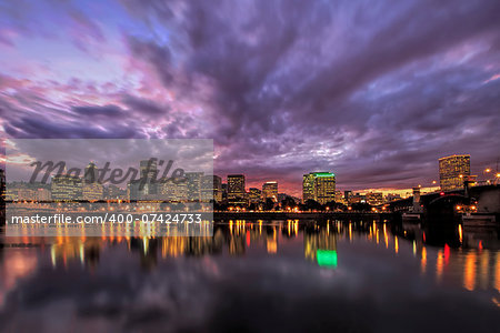 Portland Oregon Downtown Waterfront City Skyline with Reflection on Willamette River After Sunset