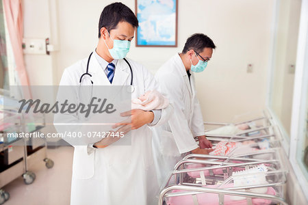 gynecologist doctor holding a newborn baby