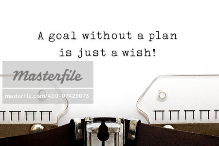 A goal without a plan is just a wish! quote printed on an old typewriter.