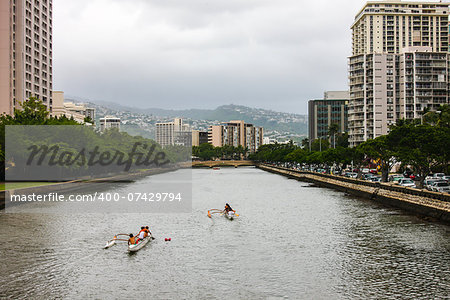 Popular canoe racing along the Ala Wai canal close to Waikiki.