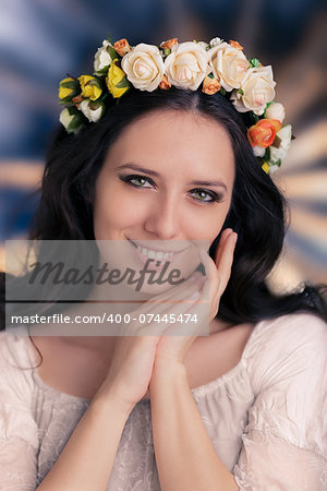 Beautiful young woman wearing a floral wreath, on a glowing background
