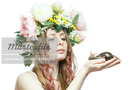 pretty girl with snail in hand and flower crown on head isolated in white background