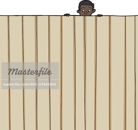 Amazed male child looking over wooden fence