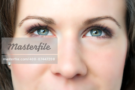 Closeup of young woman with blue eyes and nose