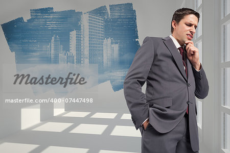 Thoughtful businessman with hand on chin against abstract screen in room showing technology interface