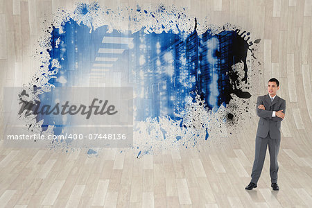 Businessman with arms folded against splash showing data hallway