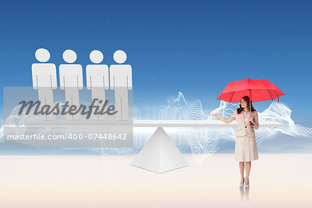 Attractive businesswoman holding red umbrella against white human resource scales in desert