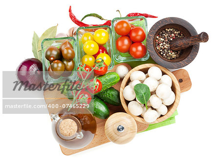 Fresh ingredients for cooking: tomato, cucumber, mushroom and spices. Isolated on white background