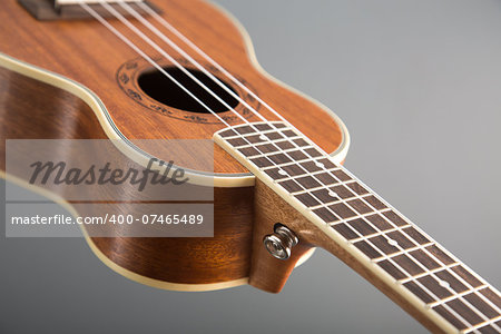 Close-up shot of classic ukulele guitar, selective focus