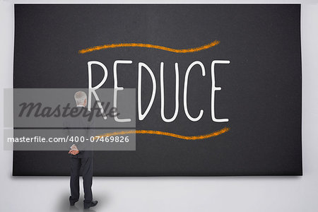 Businessman reading the word reduce