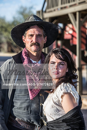 Portrait of an old west woman and sheriff