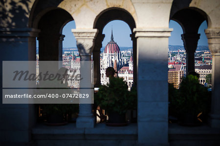 View of Hungarian Parliament Building with customers at Buda Castle restaurant, Budapest, Hungary