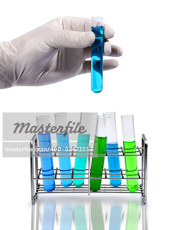Gloved hand holds laboratory test equipment glass tube