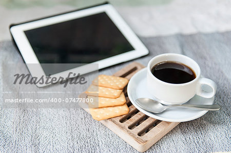Coffee with bread or cookies for breakfast.
