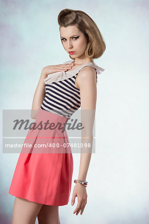 lovely blonde female posing in fashion shoot with vintage style, cute make-up and bracelets lovely blonde female posing in fashion shoot with vintage style, cute make-up and bracelets