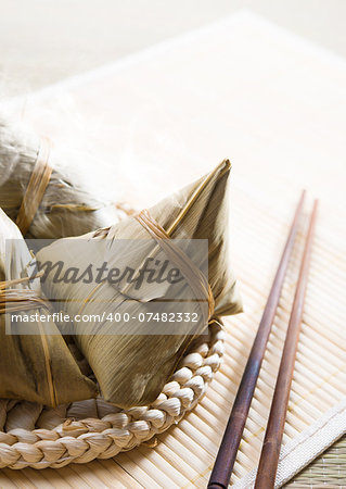 Chinese rice dumplings on bamboo place mat