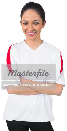 Pretty football fan in white smiling on white background