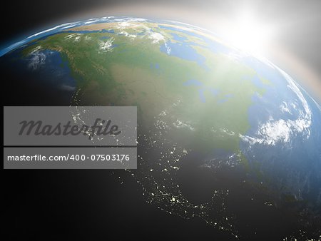 Space view of the sun rising over North America on planet Earth. Elements of this image furnished by NASA.