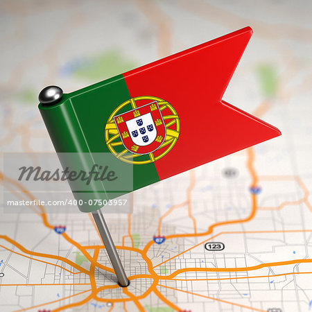 Small Flag of Portugal Sticked in the Map Background with Selective Focus.