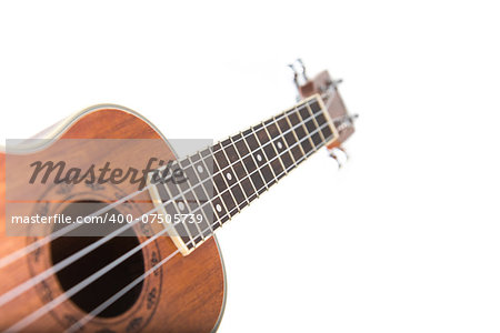 Close-up shot of ukulele guitar, isolated on white background