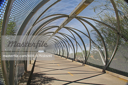 Inside the tail end of the diamondback rattlesnake bicycle and pedestrian covered bridge over Broadway Blvd. at the Barraza-Aviation Parkway, just east of downtown Tucson, Arizona.