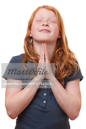 Portrait of a praying young girl on white background