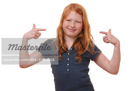 Portrait of a young girl pointing up on white background