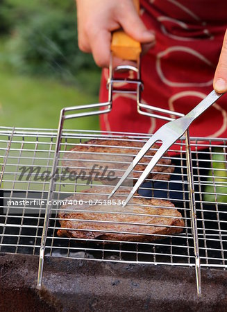 beef steak grilled on a barbecue outdoors