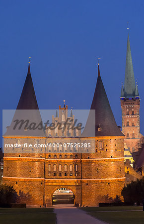 Holstein gate and Petri church by night in Lubeck, Germany