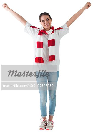 Excited asian football fan cheering on white background