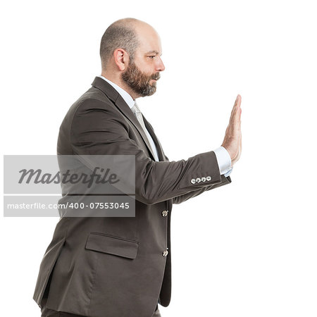 An image of a handsome business man pushing something