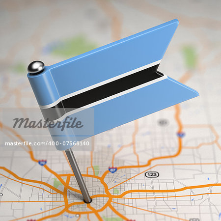 Small Flag of Republic of Botswana on a Map Background with Selective Focus.