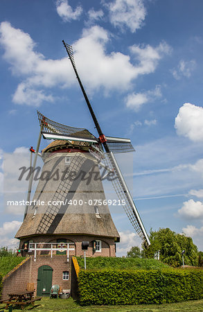 Beatrix mill in Winssen, the Netherlands against a blue sky