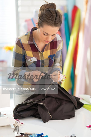 Seamstress working with fabric