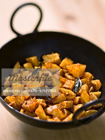 close up of a bowl of vegetarian indian potato masala curry