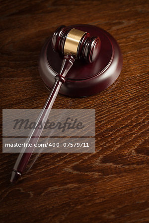 Dark Wooden Gavel Abstract on Table with Room for Text.