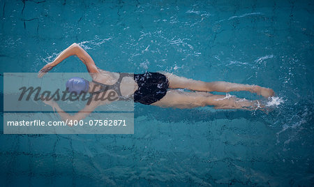 Fit woman swimming in the pool at the leisure center