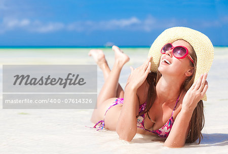 long haired girl in bikini on tropical beach